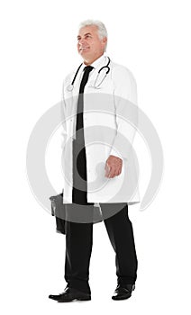 Full length portrait of male doctor with briefcase isolated on white