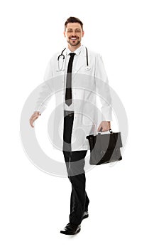 Full length portrait of male doctor with briefcase. Medical staff