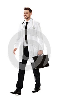 Full length portrait of male doctor with briefcase. Medical staff