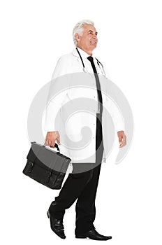Full length portrait of male doctor with briefcase. Medical staff