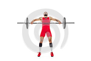 Full length portrait of man in red sportswear exercising with a weight isolated on white background. Sport