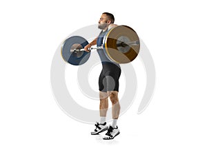 Full length portrait of a man in sportswear exercising with a weight isolated on white background