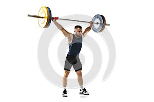 Full length portrait of a man in sportswear exercising with a weight isolated on white background