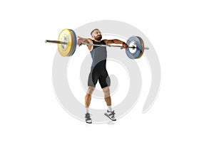 Full length portrait of a man in sportswear exercising with a weight isolated on white background