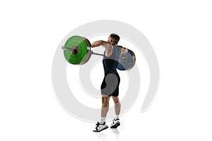 Full length portrait of a man in sportswear exercising with a weight isolated on white background