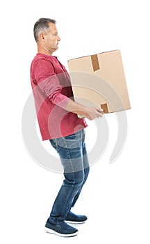 Full length portrait of mature man carrying carton box