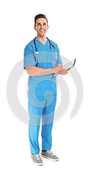 Full length portrait of medical assistant with stethoscope and clipboard on white