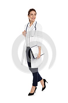 Full length portrait of medical doctor with clipboard and stethoscope