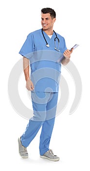 Full length portrait of medical doctor with clipboard and stethoscope isolated