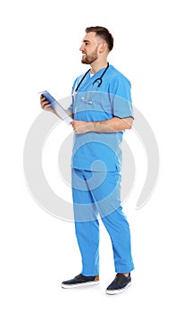 Full length portrait of medical doctor with clipboard and stethoscope isolated