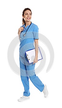 Full length portrait of medical doctor with clipboard and stethoscope on white