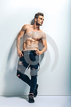 Full length portrait of a muscular shirtless man