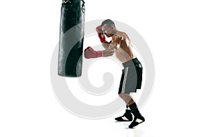 Full length portrait of muscular sportsman with prosthetic leg, copy space. Male boxer in red gloves.