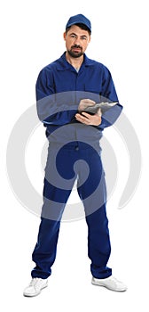 Full length portrait of professional auto mechanic with clipboard on background