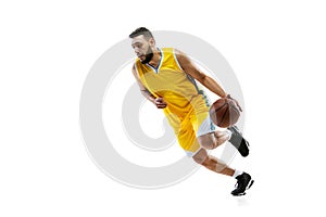 Full length portrait of professional basketball player training isolated on white studio background. Sport, motion