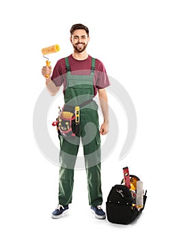 Full length portrait of professional construction worker with tools on white