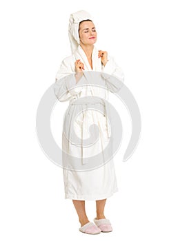 Full length portrait of relaxed woman in bathrobe