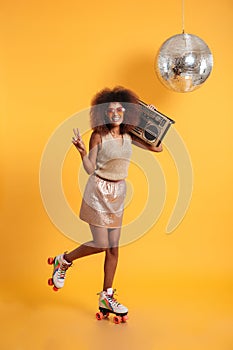 Full length portrait of smiling afro american disco woman in sun