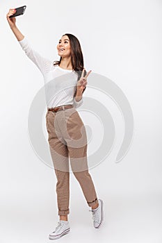 Full length portrait of a smiling asian businesswoman