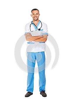 Full length portrait of smiling confident doctor with arms cross
