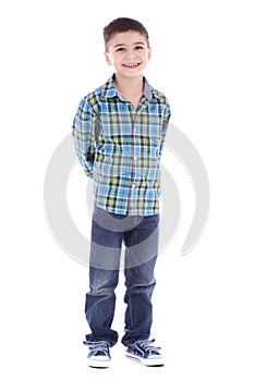 Full length portrait of smiling little boy in jeans and cup