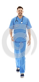 Full length portrait of smiling male doctor in scrubs . Medical staff