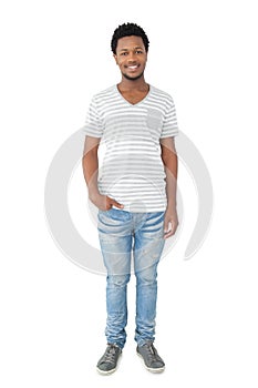 Full length portrait of a smiling young man