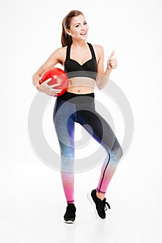 Full length portrait of a sport woman with red ball