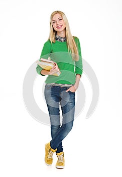 Full length portrait of student girl with books