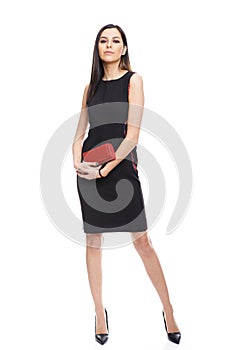Full length portrait of stylish young woman posing isolated on a white background