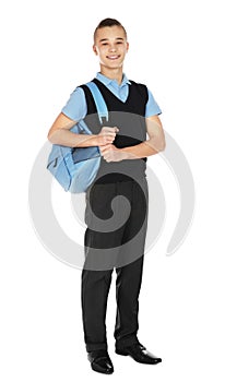 Full length portrait of teenage boy in school uniform with backpack on white