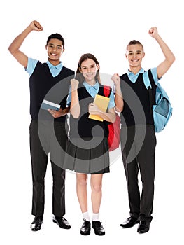Full length portrait of teenagers in school uniform on white