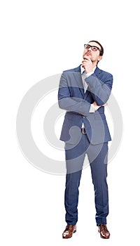 Full length portrait of thoughtful businessman keeps hand under chin, looking up pensive isolated on white background. Reflective