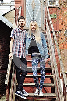 Full length portrait of two hipsters outdoor