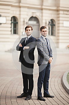 Full length portrait of two stylish businessmen