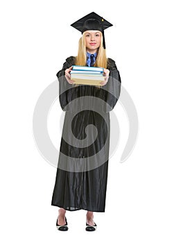 Full length portrait of woman in graduation gown