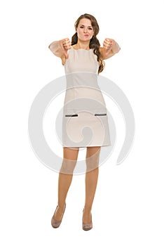 Full length portrait of woman showing thumbs down