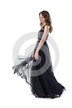 Full length portrait of young beautiful woman in black evening d