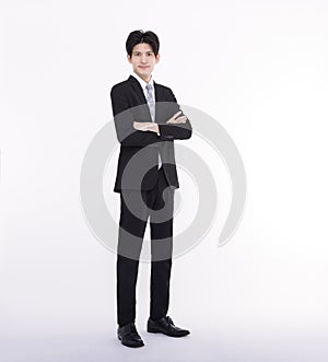 Full length portrait of young businessman standing