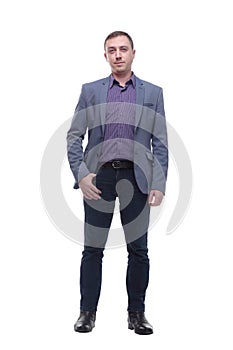 Full length portrait of a young businessman standing with his hands in the pockets.