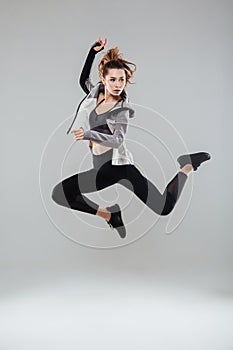 Full length portrait of a young healthy woman in sportswear