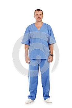 Full length portrait of a young male doctor in a medical surgical blue uniform