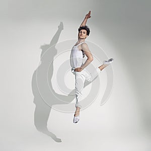 Full length portrait of a young man dancing