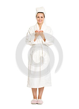 Full length portrait of young woman in bathrobe