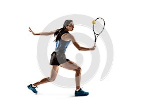 Full length portrait of young woman playing tennis isolated on white background