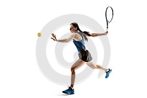 Full length portrait of young woman playing tennis isolated on white background