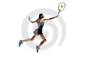 Full length portrait of young woman playing tennis isolated on white background