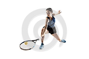 Full length portrait of young woman playing tennis isolated on white background