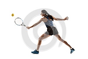 Full length portrait of young woman playing tennis isolated on white background