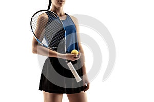 Full length portrait of young woman playing tennis isolated on white background